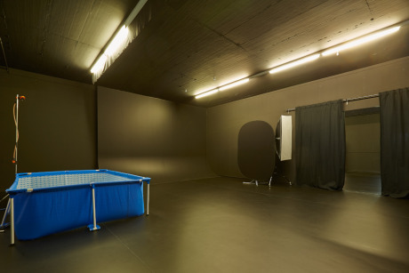  Low-key black room with cyclorama wall & water basin gallery